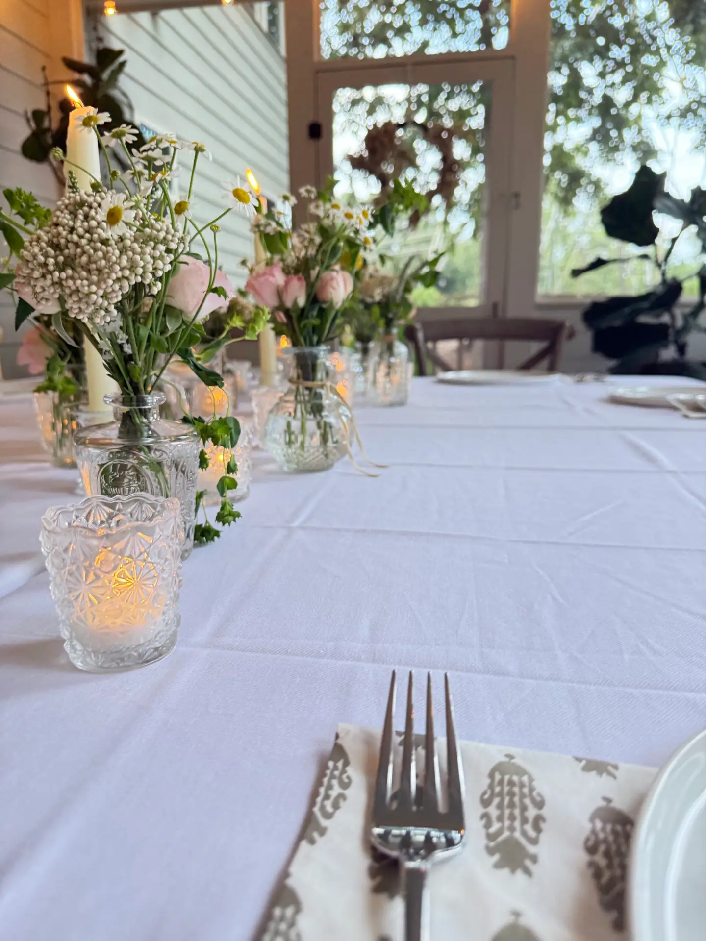 Beautiful dinner table with flowers and candles
